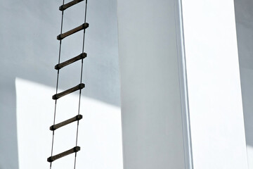 Rope Ladder with White Building Background.