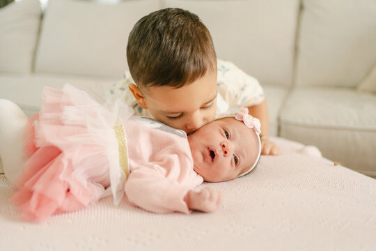 toddler and his  newborn baby sister  