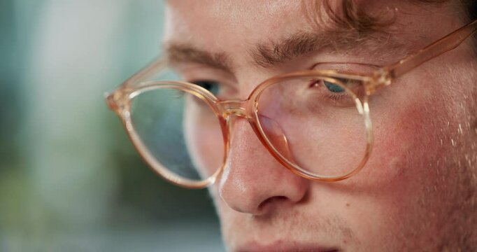 Reading, eyes and man with glasses for care, blue light protection and vision while working. Male person, optometry and prescription eyeglasses for health, visual healthcare and typing on computer