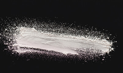 Stroke of powder in the center, black background