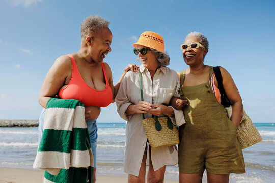 Senior friends enjoying a day at the beach