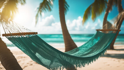 Low-angle shot of a hammock swaying gently between two palm trees on a tropical beach, overlooking the turquoise ocean.