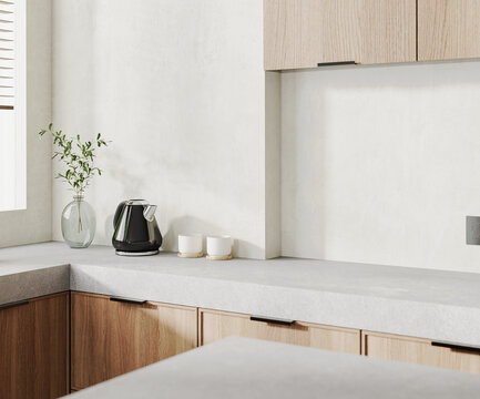 Close up of kitchen countertop with kettle and cups, wooden cabinets