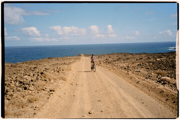 Scanned image of a professional gravel cyclist riding in Lanzarote