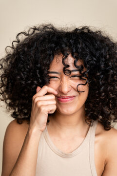 woman winking with curly hair