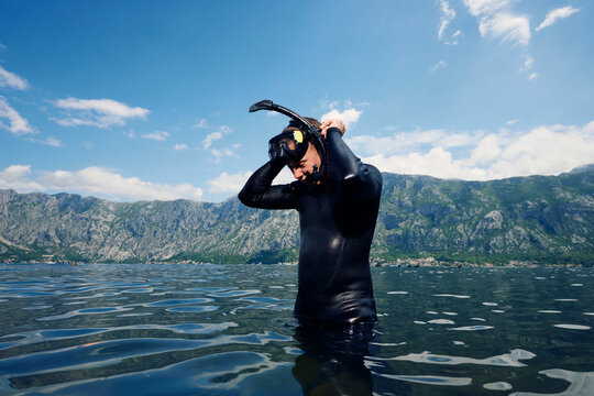 Diver adjusts his gear