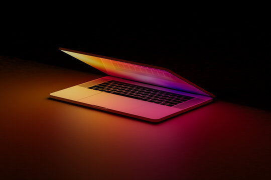 Illuminated laptop screen in dark room, concept of technology