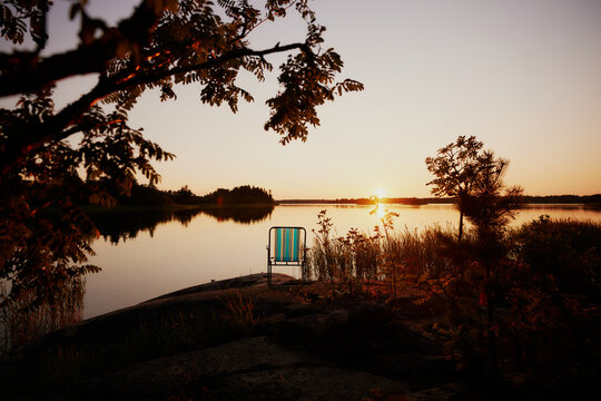 a summer yard chair in front of sunset