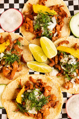Mexican tacos with condiments and vegetables