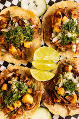 Mexican tacos with condiments and vegetables