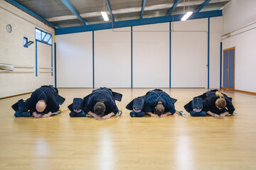 Kendo Practitioners Bowing in Dojo