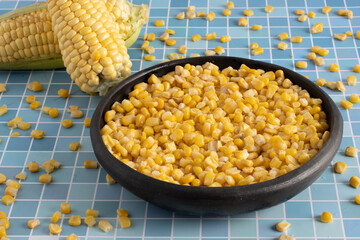 Shelled corn in a black container