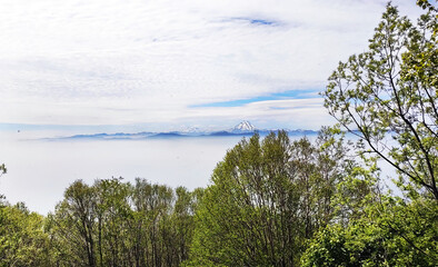 View from Mishennaya sopka on Viliuchinsky Volcano, Magnificent aerial view of the Pacific Ocean and green hills. Kamchatka Peninsula, Russia.
