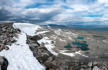 View from Bolnatind, on the arctic circle in Helgeland, Norway. Cloudy day in the norwegian fjell. High resolution panoramas of saltfjellet and Svartisen Nasjonalpark. Glacier and mountains