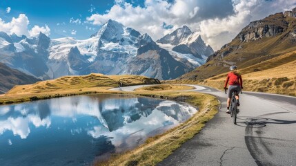 A professional cyclist races down winding mountain road, the stunning landscape and dynamic motion capture the excitement of competitive cycling.