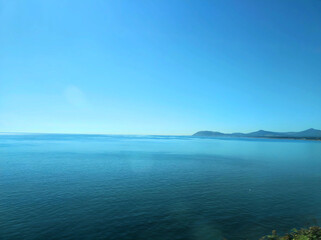 Obraz premium view of the sea and mountains from the train