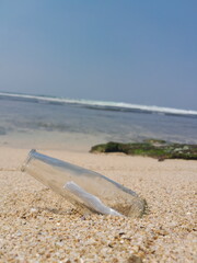 glass bottle at the beach