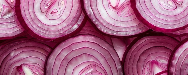 Fototapeta premium Close-up of sliced red onions, top view. Fresh vegetable texture, healthy eating concept
