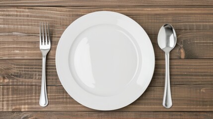 Top view of a clean plate with spoon, fork, and knife, wooden background, isolated with studio lighting, clear and high-quality for food display advertising