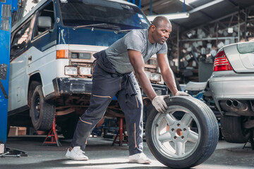 Mechanic Rolling Car Tire