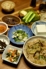 A lot of different dishes arrayed on the dinner table in japan.
