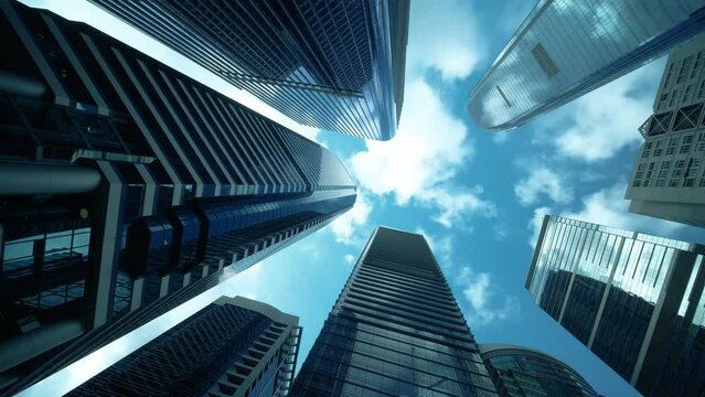 Low angle view of city skyline buildings, blue sky and glass mirrored facades. Time lapse.
