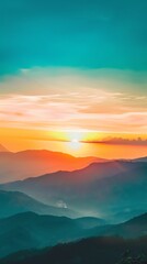 Obraz premium Breathtaking sunrise over misty mountains with vibrant colors in the sky, evoking a sense of peace and tranquility in nature's beauty.
