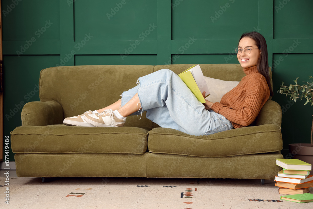 Sticker young woman with book lying on sofa at home