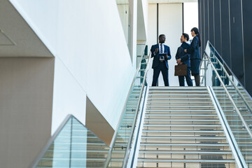 Group of multinational business people having a conversation in a lobby