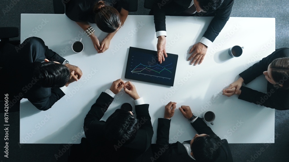 Poster top down aerial view of smart businessman looking at financial chart while hold tablet display stock