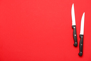 Sharp knives on red background
