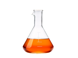 a glass beaker with orange liquid