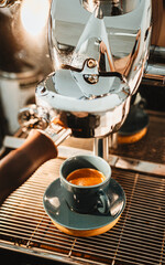 espresso coffee maker Espresso poruing from coffee machine at cafe