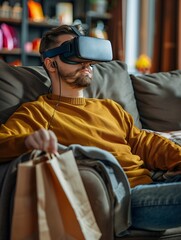 Fototapeta premium A white male uses virtual reality glasses to shop and make purchases while sitting on a couch with bags and using advanced technology.