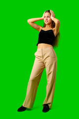 Young Woman Making a Surprised Face in Front of Green Screen