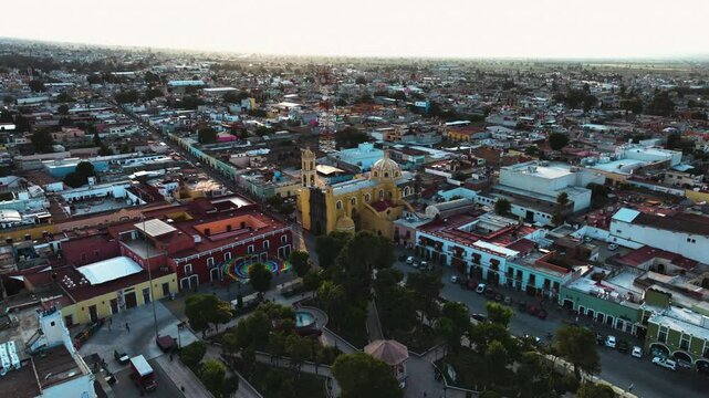 Drone tilting backwards over the San Luis Obispo Baroque, sunset in Huamantla, Mexico