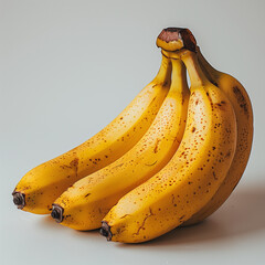 A bunch of ripe bananas on a white background