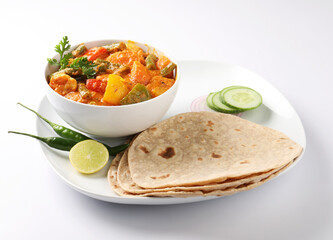 Mix vegetable curry - Indian main course recipe contains Carrots, cauliflower, green peas and beans, baby corn, capsicum served with Chapati
