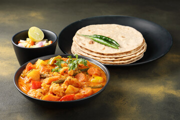 Mix vegetable curry - Indian main course recipe contains Carrots, cauliflower, green peas and beans, baby corn, capsicum served with Chapati
