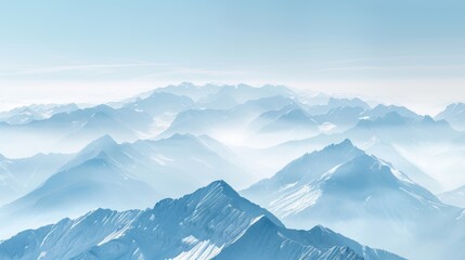 A breathtaking view of snow-capped mountain ranges under a clear blue sky, evoking tranquility and natural beauty.
