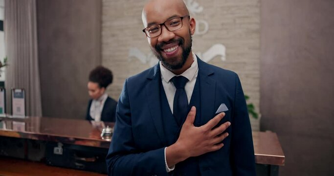 Portrait, black man and happy as hotel manager with confidence or pride for career growth and opportunity. Leader, boss and smile in help desk lobby in help, support and hospitality service or escort