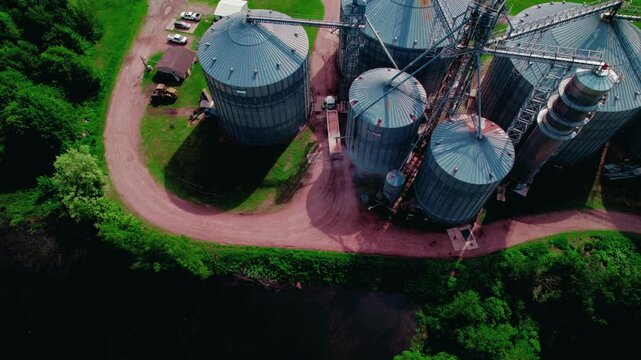 Hopper trailer semi truck driver loading with grain from a grain elevator in Wisconsin Rapids, WI, USA