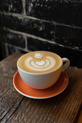 cup of coffee latte brick background
