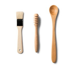 Set of wooden kitchen utensils on white background, top view