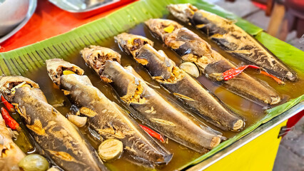 Street food in Thailand. Sales of pickled catfish (Catfish Stew) is popular with tourists and Thailand people. Thai local street market