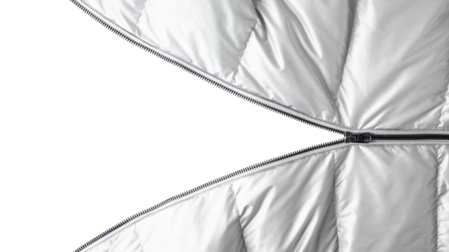 Open dark grey metal zipper on silver color winter down jacket isolated  on white background with copy space.