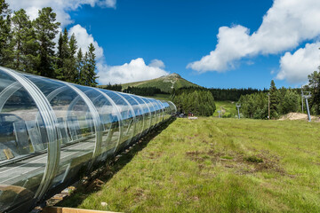 Lofsdalen mountain and ski facility where a tube is prepared where the children can ride safely up with their skis.