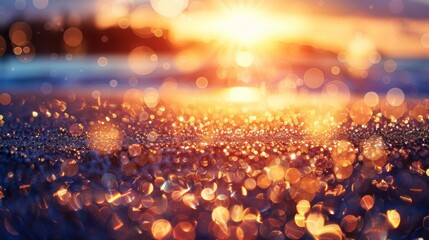 A mesmerizing view of a sunset at the beach, with sparkling sand and a bokeh effect creating a magical atmosphere.