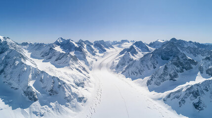 Fototapeta premium Majestic Snowy Mountain Range with Glacial River - Aerial View of Pristine Winter Landscape under Clear Blue Sky