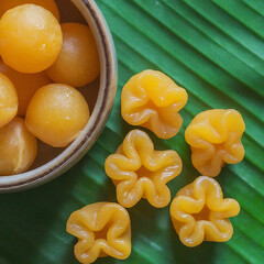 Thong Yip and Thong Yod are auspicious traditional Thai desserts known for their distinctive yellow color. They are made from egg yolks that are beaten until fluffy and then dropped into syrup to form